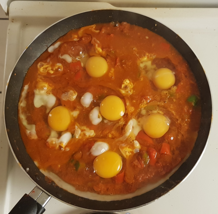 Add the eggs to the shakshuka sauce